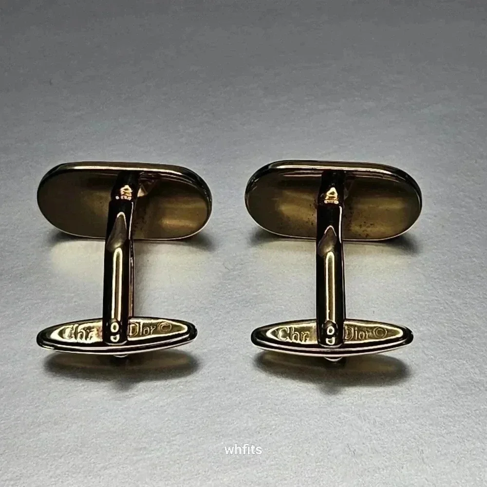Christian Dior black and gold tone cufflinks and tie bar set